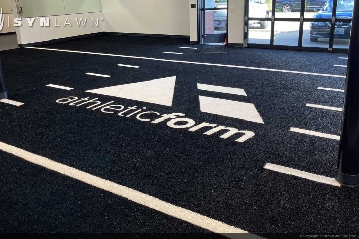 SYNLawn Des Moines IA Prefab turf logos for athletic weight room applications